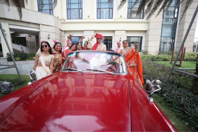 Groom and guests in the Baraat took photos together